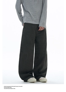 Detail view of dark grey wide-leg cargo pants for men with premium cotton fabric texture