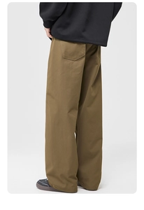 Detail view of khaki retro cargo pants showing twill fabric texture and back pocket design