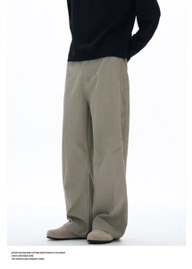 Detail of khaki wide-leg utility pants showing expert seam stitching and dart construction