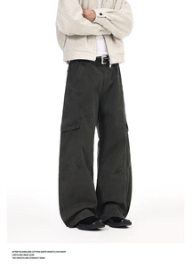 Detail shot of multi-pocket cargo pants with contrast stitching and loose wide-leg fit