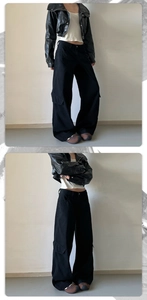Detailed look at black wide-leg cargo pants and faux leather jacket streetwear outfit