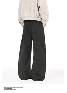 Rear view of black wide-leg cargo pants featuring functional multi-pocket utility design