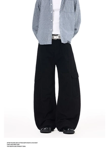 Close-up of black cargo pants featuring oversized utility pockets and durable fabric texture