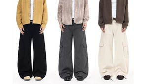 Three men wearing baggy cargo pants in black, grey, and beige with large flap pockets