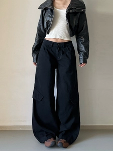 Vintage style high-street black cargo pants with wide leg and classic flap side pockets