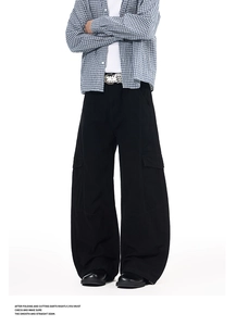Detail view of black wide-leg cargo pants with large side pockets and durable cotton fabric