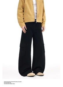 Detailed view of black wide-leg cargo pants with large flap side pockets in vintage style