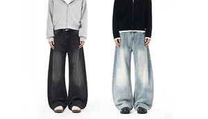 Detailed comparison of wide-leg baggy jeans in washed dark grey and light blue denim