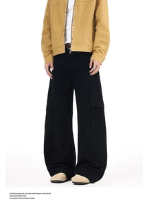 Detail of men's black cargo pants with wide-leg silhouette and multi-pocket design