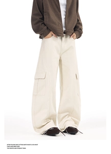 Detail of cargo pocket and heavy twill fabric on cream-colored wide leg pants