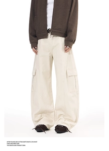Detail of off-white wide-leg cargo pants featuring large flap pockets and twill cotton fabric