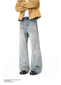 Detail of washed vintage high-street flare jeans with cat-whisker whiskers and distressing
