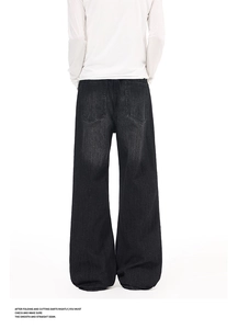 Detailed back view of vintage washed black flare jeans with deep rear pockets