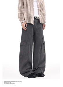 Detailed view of cargo side pockets on washed wide-leg street style trousers
