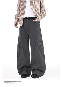 Detail view of dark grey cargo pants with side flap pockets and vertical seam stitch design