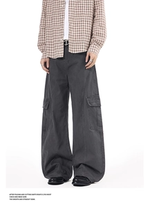 Detailed view of the dark grey wide-leg cargo pants with large side flap pockets