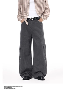 Detail of dark gray wide-leg cargo pants featuring washed texture and large side flap pockets
