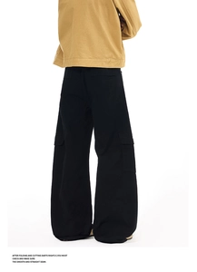Rear view of black wide-leg cargo pants with side flap pockets and premium stitching