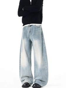 Men's loose vintage washed blue curved denim jeans with stylish distressed finish