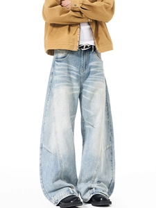 Men's light blue vintage washed wide-leg jeans with whiskered patterns and an oversized fit