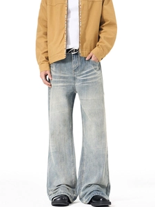 Men's light blue washed flare jeans in retro vibe style with distressed whisker details