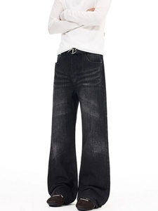 Retro washed black wide leg denim jeans with vintage whiskering and metal V-buckle belt