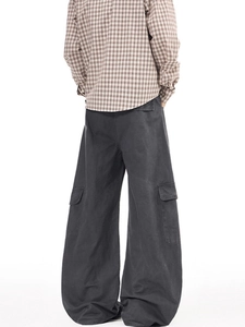 Oversized dark grey cargo pants with wide leg and side pockets in classic American street style
