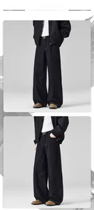 Front and side view of men's wide-leg black denim pants with horsehide leather patchwork