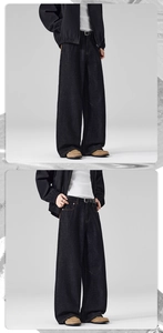 Detail of baggy raw denim jeans with a straight cut and dark finish in cleanfit style