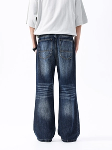 Jeans uomo larghi retrò con lavaggio vintage e dettaglio baffi in denim scuro