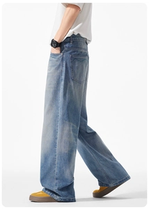 Detailansicht der hellblauen Wide-Leg-Jeans mit Vintage-Waschung und grüner Wellennaht