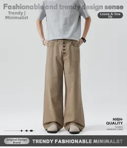 Detail of vintage washed khaki trousers featuring a multi-button fly and a loose A-line fit