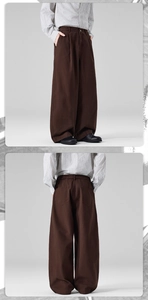 Detail view of men's wide-leg cotton pants in dark brown with elastic waist and pockets