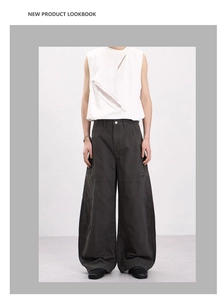Detail of white mesh patchwork tank top paired with oversized grey cargo pants
