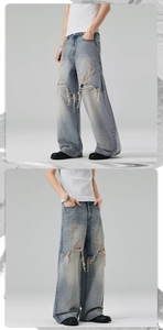 Detail of light wash denim jeans featuring heavy distressed rips and fringe fraying