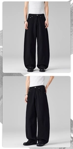 Détails du jean noir à jambe large et taille haute avec bouton métallique de qualité