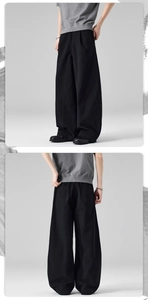 Front and back view of men's black wide-leg cotton pants with pleated front and pockets