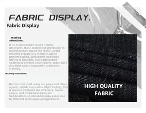 Detailed fabric texture of washed denim jeans with care and washing instructions labels