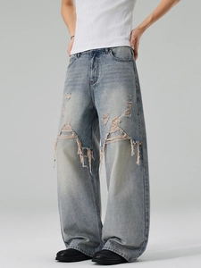 Men's light blue distressed wide-leg jeans with street-style ripped details and baggy fit