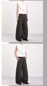 Detailed view of dark grey wide-leg cargo pants with stitching and side pocket design