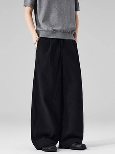 Men's minimalist black wide-leg cotton trousers with front pleats and draped silhouette