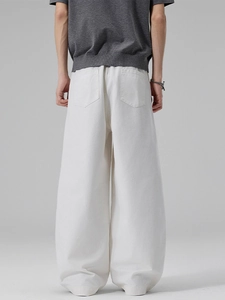 Back view of men's white wide-leg cotton pants featuring minimalist stitched pockets