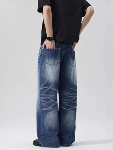 Jean large homme en délavage bleu foncé avec moustaches de style vintage et coupe ample