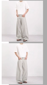 Vue complète de face d'un pantalon cargo large kaki clair avec design plissé moderne