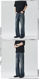 Gros plan d'un jean homme large avec délavage vintage et détails de moustaches