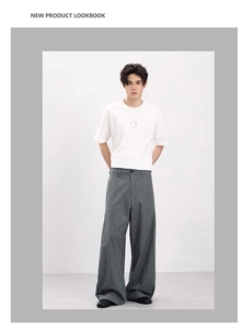 Detailed look at gray plaid wide-leg trousers paired with a classic white short sleeve tee