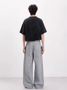 Men's vintage washed black t-shirt and grey wide-leg cargo pants set from back view