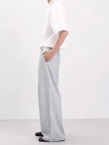 Men's grey wide-leg trousers with bamboo texture and drape, styled for cleanfit look