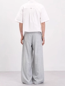 Minimalist men's set with white short-sleeve shirt and light gray wide-leg casual pants