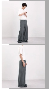 Vertical view of white crew neck T-shirt paired with grey-green plaid wide-leg trousers